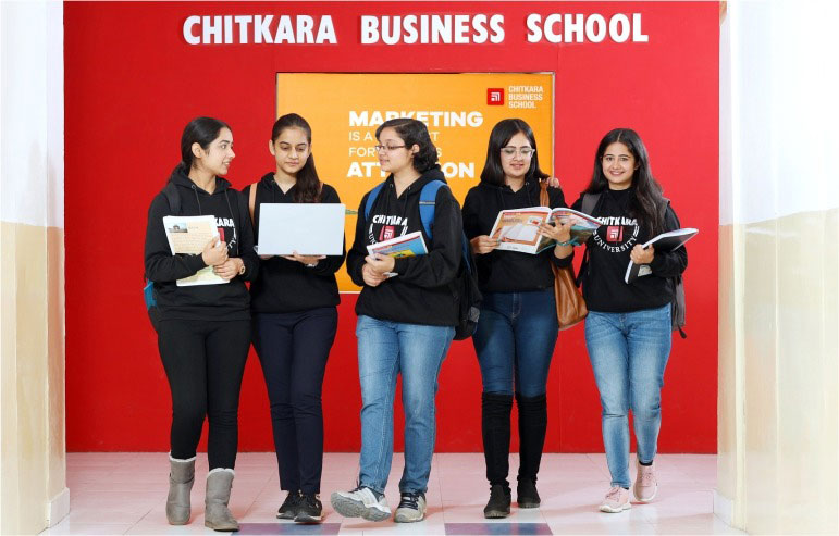 A image with a red background shows the 5 students of chitkara university.
